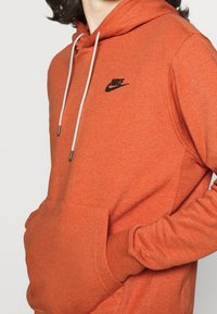 Nike Sportswear Mikina s kapucí - metallic red