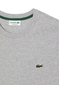 Lacoste Triko s potiskem - hellgrau