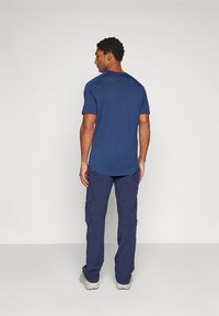 Norrøna FEMUND FLEX1 PANTS - Hlače za otvoreno - navy blazer