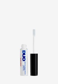 Clear tube of DUO Quick-Set Strip Lash Adhesive featuring a white applicator wand and black cap, labeled with blue and red text.
