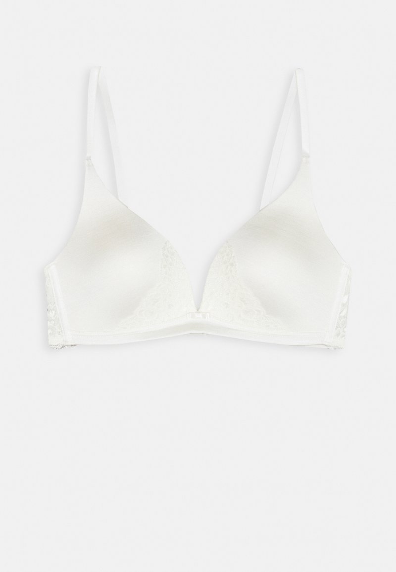 Senza cuciture bianco con pizzo, presenta coppe a triangolo, spalline regolabili e una chiusura a gancio sul retro.