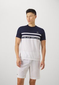 Lacoste Sport T-SHIRT TC - Sport T-shirt - white/navy blue