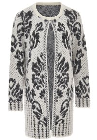 Cardigan lungo bianco e nero a motivo, con texture pelosa, apertura frontale e borchie decorative sui polsini. Presenta un intricato design floreale.