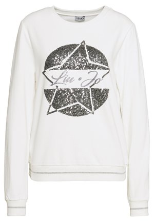 Biała bluza z długim rękawem z czarną gwiazdą z cekinów i napisem "Liu Jo" umieszczonym na środku przodu, ściągacze na rękawach i dolnym brzegu z srebrnymi paskami.