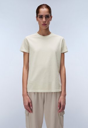 Light beige cotton t-shirt with short sleeves and a round neckline, featuring a solid color and relaxed fit. Displayed frontally.