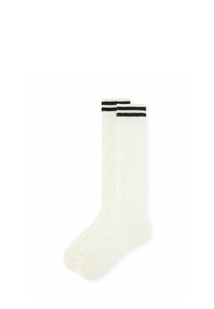 Paire de chaussettes blanches montantes avec une texture subtile et deux bandes horizontales noires en haut.