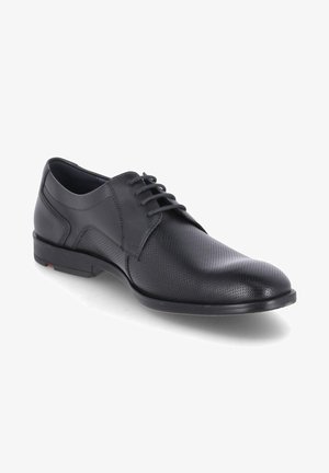 Black leather lace-up shoe with a perforated design, rounded toe, and a smooth texture. Features a thin, flat sole with subtle accents.