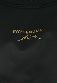 Black sportswear fabric featuring the text "SWEDEMOUNT" in gold above a mountain silhouette design. Smooth texture, fitted shape.
