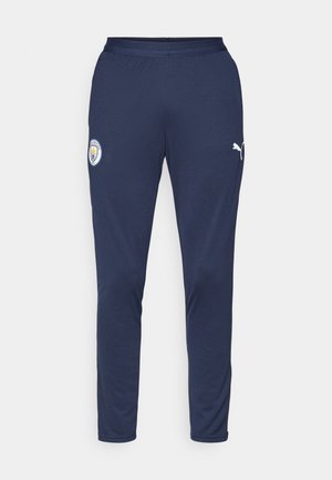 Marineblå sportsbukser lavet af åndbart materiale, med en tætsiddende design, elastisk talje og hvide logo accenter på låret.