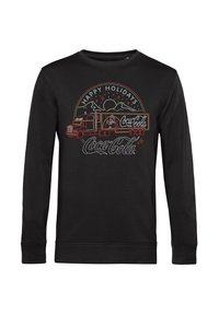 Felpa nera a maniche lunghe con un design a tema festivo che presenta un camion della Coca-Cola, montagne e testo con accenti bianchi e rossi.