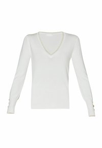Pull blanc à manches longues et col en V avec une fine bordure argentée sur le col et les poignets, ainsi que de petits boutons dorés sur les poignets.