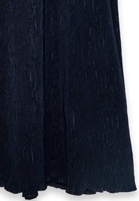 Navy pleated skirt featuring vertical ridges, flowing hem, and textured fabric. Material has a slight sheen, enhancing depth and visual interest.
