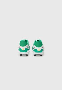 Green and white soccer cleats with a textured upper, featuring black accents and yellow detailing on the heel. Indoor/outdoor sole design.