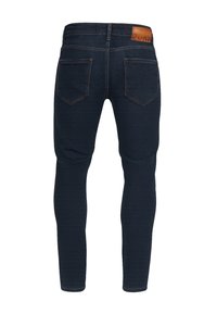 Smaltsittende mørkeblå jeans i denim med en glatt tekstur, med en lærtag bak og fem lommer med kontrastsøm.