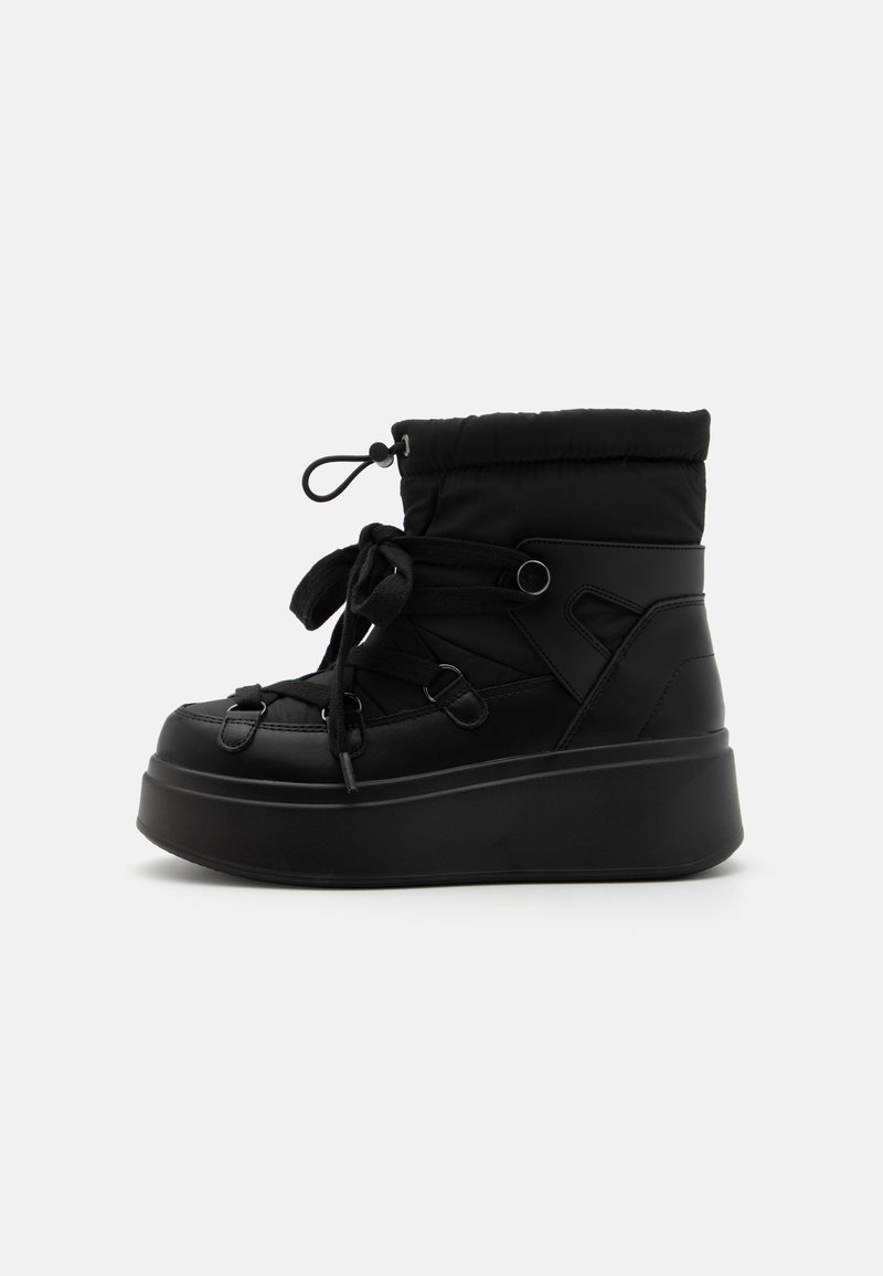 Black ankle boots featuring a padded upper, round toe, lace-up closure, and a thick platform sole for enhanced height and stability.