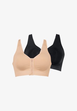 Due reggiseni senza ferretto con spalline larghe, uno beige con zip frontale e uno nero semplice, esposti su sfondo bianco.