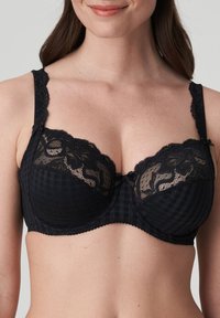 Black bra featuring a checkered pattern with lace detailing, scalloped edges, and adjustable straps. Center bow accent adds a decorative touch.