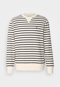 Langermet sweatshirt med V-hals design. Har vekslende marineblå og kremfargede striper og en liten brodert logo på brystet. Laget av bomullsblanding.