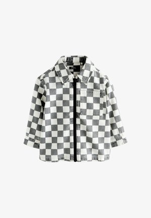 Chemise à manches longues noire et blanche à carreaux avec col, fermeture éclair devant et poche poitrine, présentée sur fond blanc.