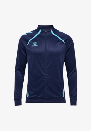 Marineblauwe sportjas met ritssluiting en lichtblauwe accenten op de schouders, zijkanten en het hummel-logo op de linkerborst.
