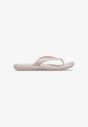 Sandale en plastique rose clair avec un design de bride entre les orteils, semelle texturée et semelle rembourrée avec un subtil bord blanc le long du contour.