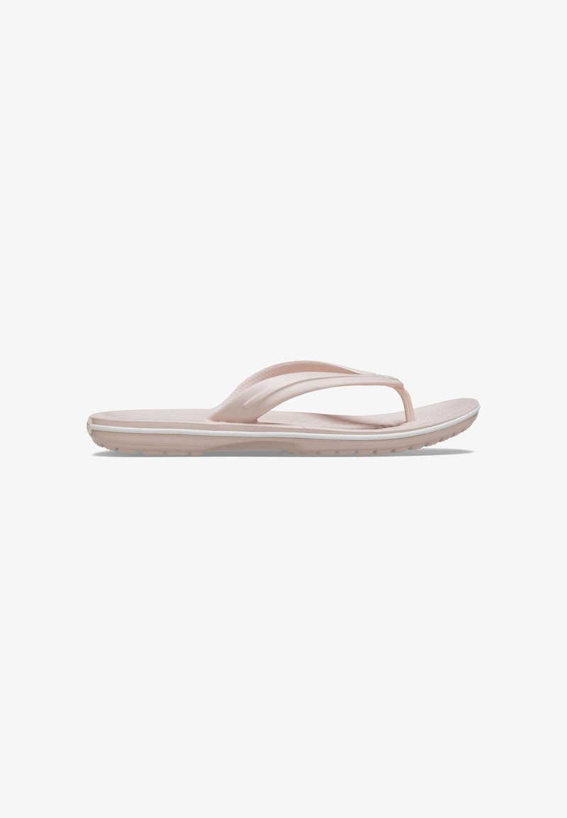 Light pink flip-flop sandal featuring a thong strap design, textured footbed, and a cushioned sole with a subtle white trim along the edge.