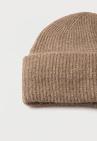 Brown knit beanie made of soft wool. Features a ribbed texture and rolled cuff at the bottom. Compact, warm, and versatile in design.