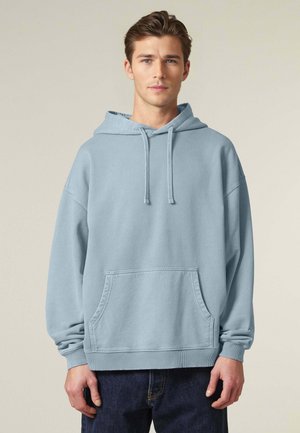 Felpa leggera blu con tasca frontale, lacci e polsini a coste. Realizzata in tessuto morbido con una vestibilità comoda e spalle scese.