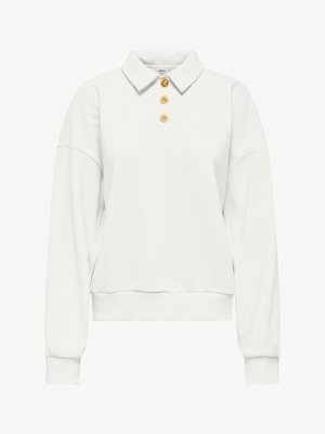 Bílý dlouhý rukáv pulovr s límcem a třemi zlatými knoflíky ve tvaru slunce uprostřed vpředu.