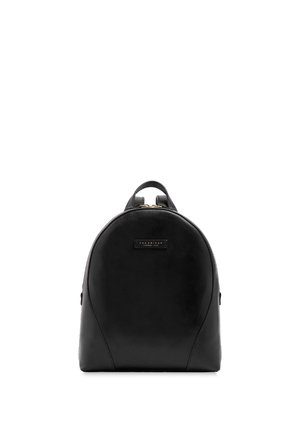 Black leather backpack with rounded shape, single top handle, and a small rectangular logo patch on the front.