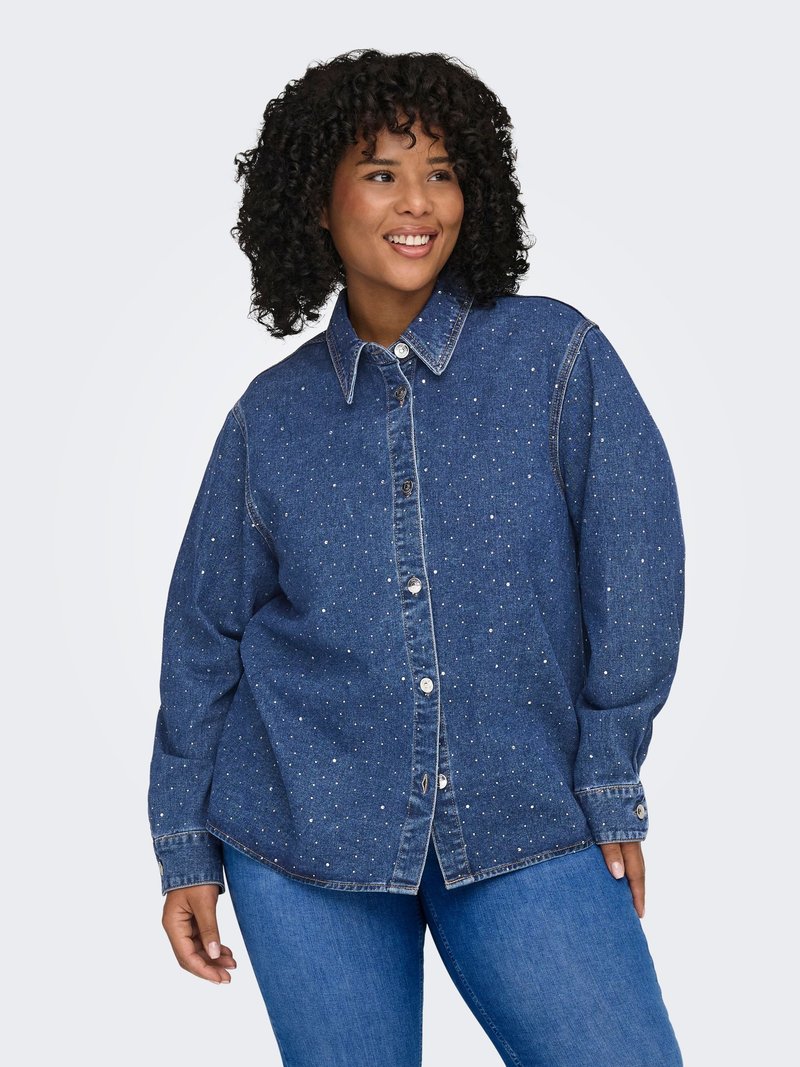 Giacca in denim con chiusura a bottoni e vestibilità morbida, caratterizzata da un colore azzurro chiaro, decorazioni a pois e maniche lunghe. Chiusura frontale con bottoni.