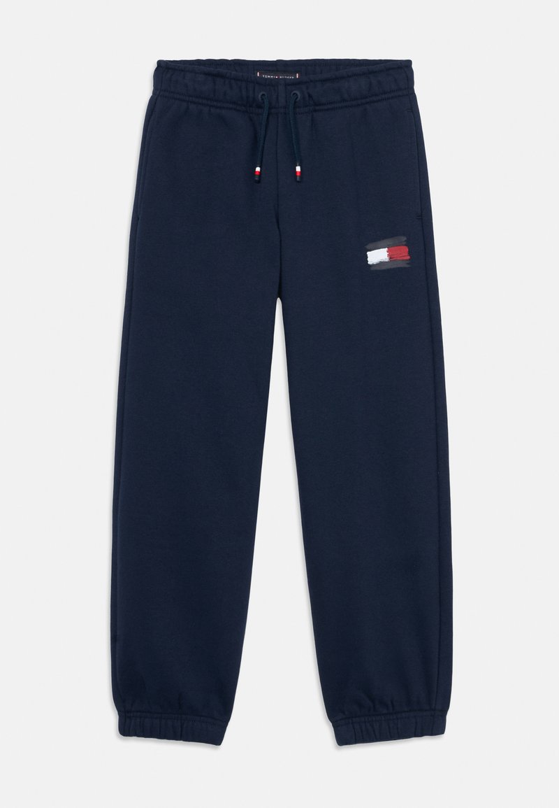 Námorníck blue tepláky vyrobené z mäkkej látky, s elastickým pásom a šnúrkou na stiahnutie, a malým logom pri oblasti vrecka.