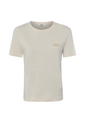 Hellbeiges T-Shirt mit kurzen Ärmeln, Rundhalsausschnitt und kleinem, goldbesticktem Logo auf der linken Brust.
