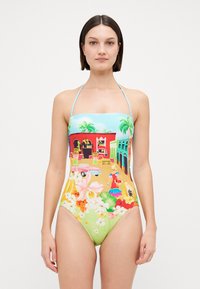 One-piece swimsuit with a light blue top featuring tropical print, colorful floral designs, and a green bottom. Straps are adjustable.