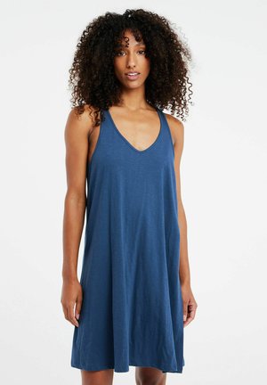 Mouwloze jurk van diepblauwe stof, met een V-hals en een A-lijn silhouet. Zachte textuur met een casual, ontspannen pasvorm.