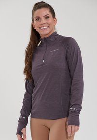 Purple long-sleeved athletic top with a zip neck. Features a heathered texture and reflective accents on the sleeves. Smooth finish.