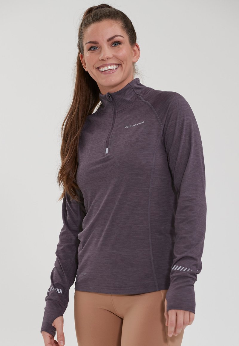 Purple long-sleeved athletic top with a zip neck. Features a heathered texture and reflective accents on the sleeves. Smooth finish.