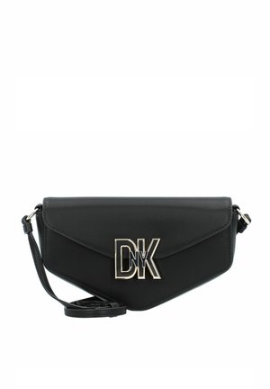 Black leather crossbody bag with a triangular shape, gold hardware logo "DK," and an adjustable strap. Smooth texture, flap closure.