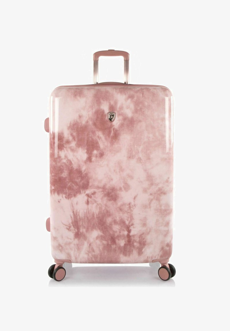 Valise rigide rose en tie-dye avec une finition brillante, équipée d'une poignée rétractable, de roues roulantes et d'un badge logo sur le devant.