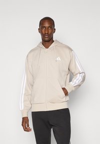 adidas Sportswear Bluză de molton cu fermoar - offwhite