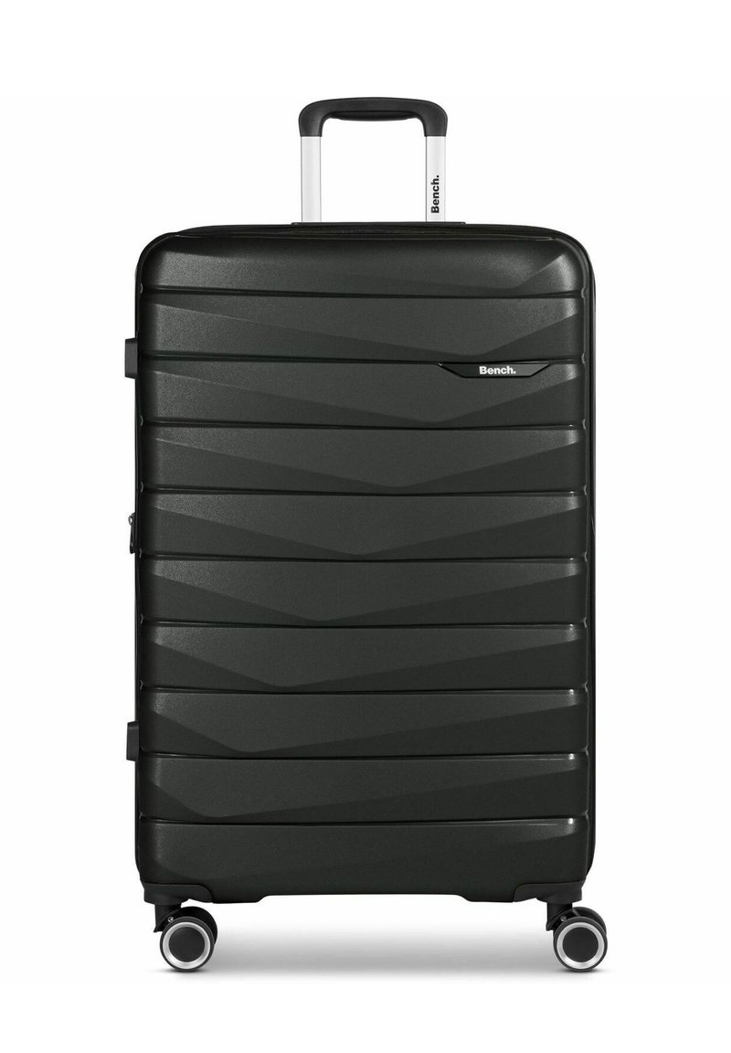 Valigia rigida in nera opaca con un design testurizzato, manico telescopico e doppie ruote per una maggiore mobilità. Presenta il logo sul fronte.