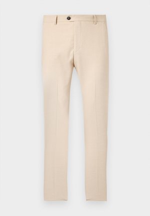 Beige slim-fit kjolebukser med bæltestropper, knap foran, lynlås og pressede folder langs benene.