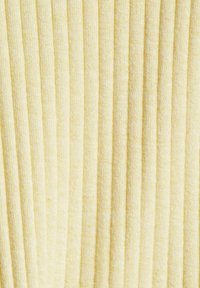 Yellow ribbed fabric featuring vertical lines, textured surface, and a soft appearance. The material is lightweight and flexible.