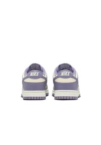 Nike sneakers featuring a purple leather upper, cream accents, padded collar, textured outsole, and distinctive logo on the heel.