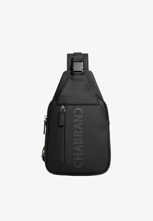 Sac bandoulière noir à finition mate. Comprend une poche zippée avant, une sangle réglable et un marquage en relief sur le côté. Design compact.