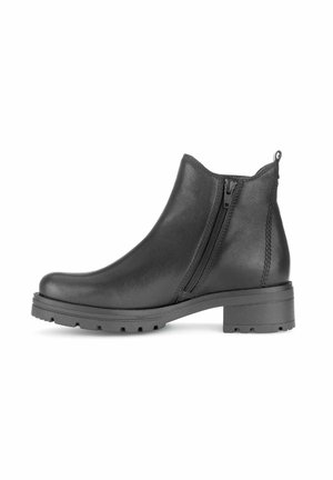 Schwarzer Leder-Stiefel mit seitlichem Reißverschluss, grober Sohle, niedrigem Blockabsatz und Zuglasche hinten, im Profil dargestellt.