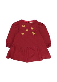 Abito rosso con maniche a sbuffo e gonna arricciata. Presenta ricami dorati a forma di cuore e fiocco sul davanti. Chiusura con cerniera sul retro. Materiale in cotone.