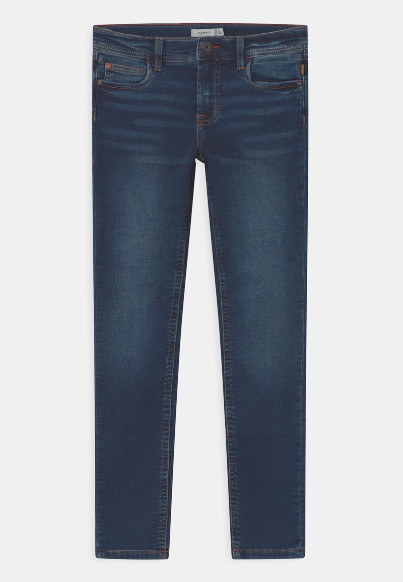 Jean slim bleu foncé avec poches avant et arrière, fermeture par boutons, et détails délavés le long des cuisses et des genoux.