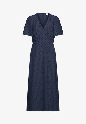 Vestido midi azul marino con escote en V, mangas cortas abullonadas y lunares negros texturizados, ceñido en la cintura con una falda fluida.