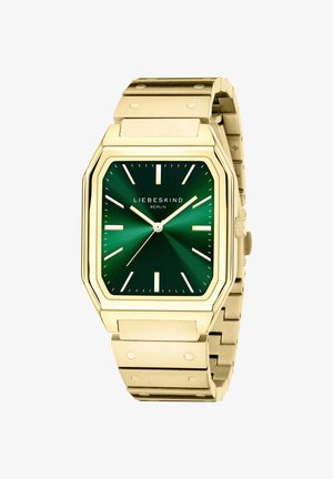 Orologio quadrato dorato con quadrante verde a raggi di sole, indici delle ore bianchi e bracciale in metallo testurizzato con dettagli a rivetto.